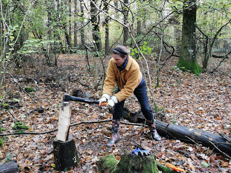 A woman chops wood